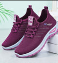 A pair of women's slip-on athletic sneakers in a deep plum purple color, featuring a breathable mesh upper, elastic lace closure, and a white and purple sole. The brand 'NEETUPULAR' is visible on the side of the shoe.